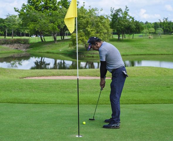 1 person golfing golf course grass and nature 1 person golfing golf course grass and nature