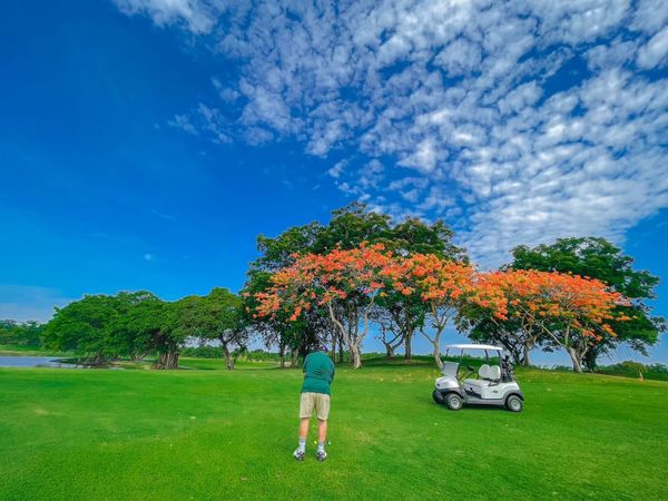 Northern Rangsit Golf Club 1 person golfing golf cart and golf course