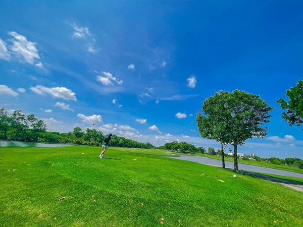 Northern Rangsit Golf Club 1 person golfing golf cart golf course and grass