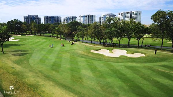Thana City Country Club 1 person grass and golf course