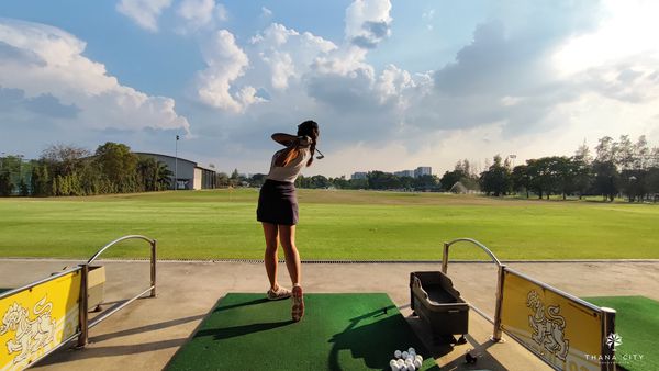 Thana City Country Club 1 person playing a sport golf course and grass