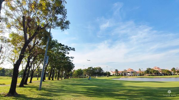 Thana City Country Club 1 person sky grass and tree