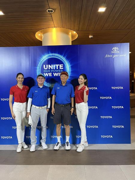 Summit Windmill Golf Club amp Residence 4 people people standing indoor and TOYOTA Move your werld UNITE OUR OURPOWER WE WII TOYO YOTA TOYOTA TOYOTA TOYOTA OYOTA TO TOYOTA TOYOTA TOYOTA TOYOTA TOY TOYOTA TOYOTA