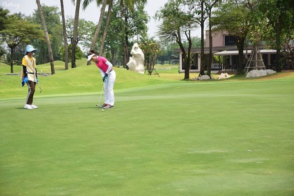 Summit Windmill Golf Club amp Residence 2 people people golfing golf course and grass
