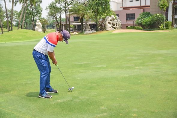 Summit Windmill Golf Club amp Residence 2 people people playing sports grass and golf course