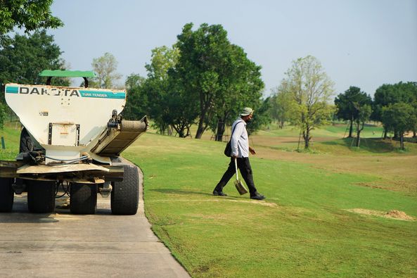 Nikanti Golf Club Nakhon Pathom 1 person golf cart golf course and road