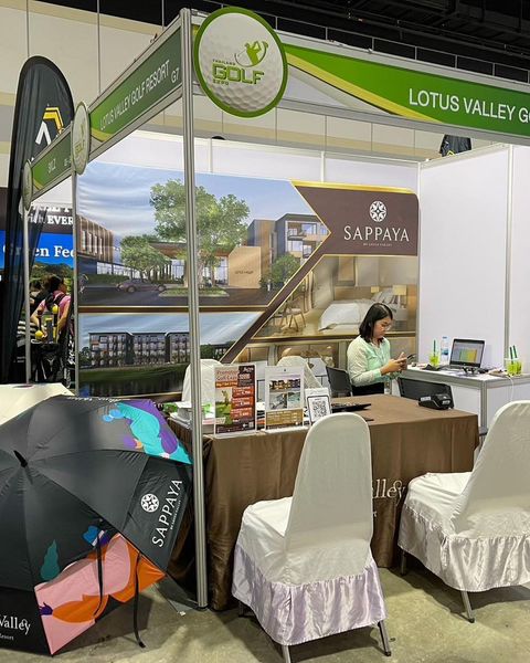 Lotus Valley Golf Resort 3 people and text