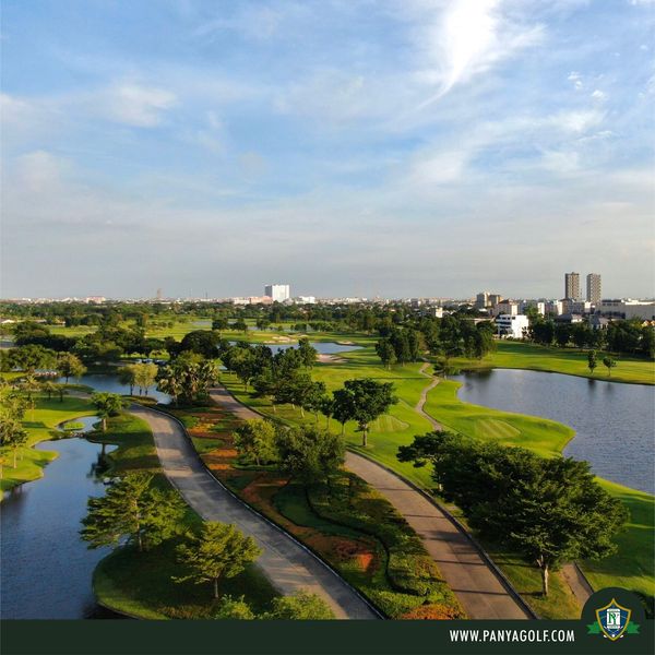 Panya Indra Golf Club 1 person lake grass golf course and text