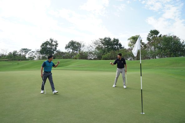 Nikanti Golf Club Nakhon Pathom 2 people people golfing golf cart and golf course