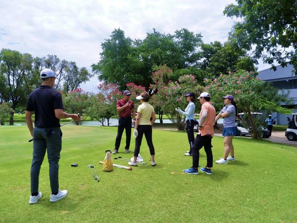 Muang Ake Golf Club 7 people people golfing golf cart and golf course