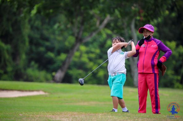 Lotus Valley Golf Resort 2 people people golfing golf course and text-4
