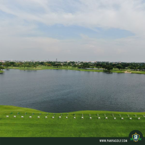 Panya Indra Golf Club golf golf course lake grass and text