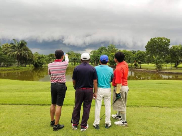 The Pine Golf Club 4 people people golfing tornado and golf course