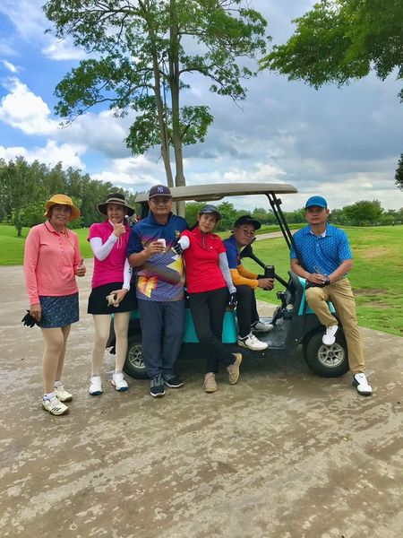 The Pine Golf Club 6 people people golfing golf cart and golf course