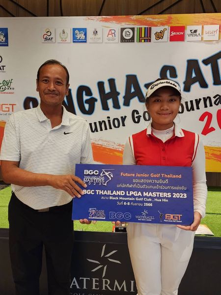Krungthep Kreetha 2 people people golfing golf course and text