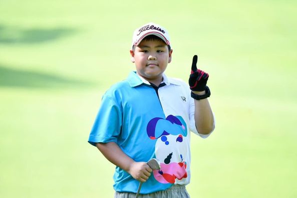 Lotus Valley Golf Resort 1 person golfing golf course and text