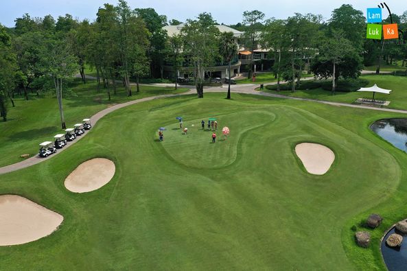 Lam Luk Ka Country Club 1 person golfing golf cart golf course and text