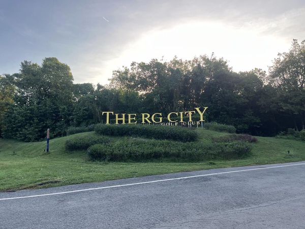 The RG City Golf Club or The Royal Gems Golf City nbsp fog grass road horizon and text