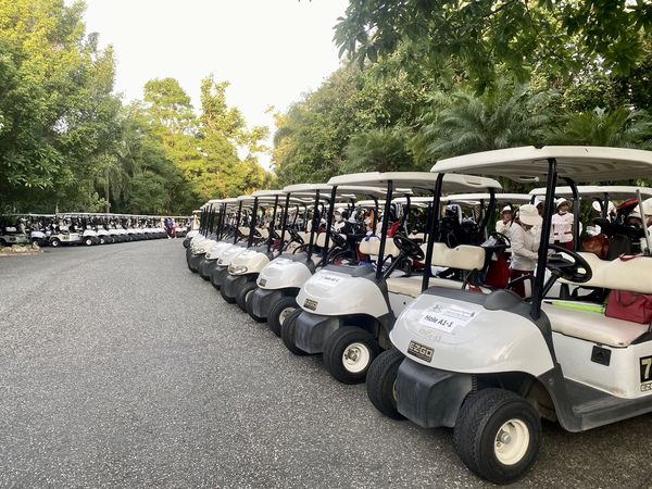 Chiangmai Highlands Golf and Spa Resort 1 person golfing golf cart golf course and text