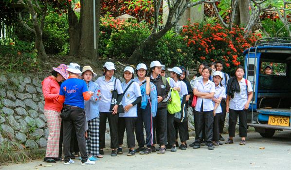 Gassan Khuntan Golf amp Resort Thailand 12 people people golfing road and text