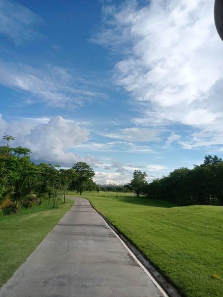 สนามกอล์ฟหริภุญชัย กอล์ฟคลับ cloud grass road tree and golf course