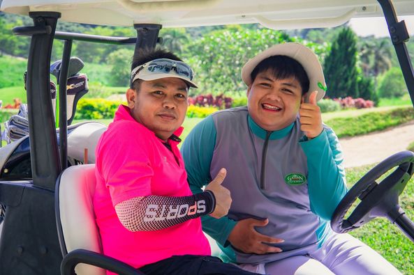 Gassan Khuntan Golf amp Resort Thailand 2 people people golfing golf cart golf course and text