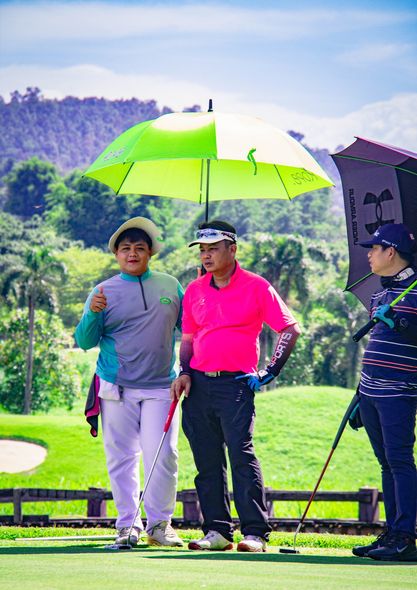 Gassan Khuntan Golf amp Resort Thailand 3 people people golfing golf course and text