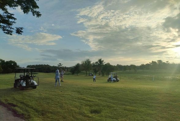 สนามกอล์ฟหริภุญชัย กอล์ฟคลับ 3 people people golfing golf cart twilight and golf course
