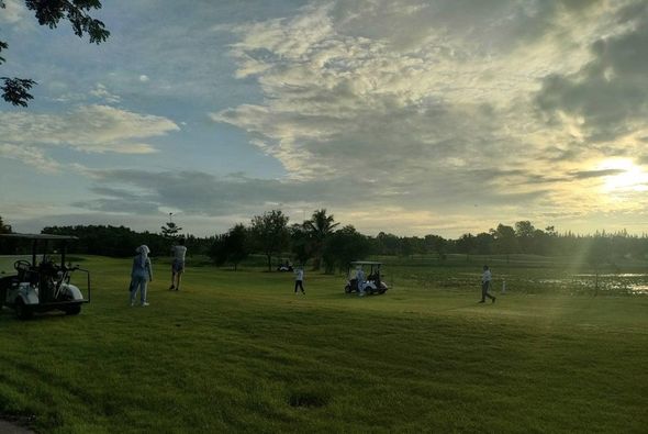 สนามกอล์ฟหริภุญชัย กอล์ฟคลับ 4 people people golfing golf cart twilight and golf course