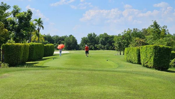 สนามกอล์ฟหริภุญชัย กอล์ฟคลับ 2 people people golfing golf cart and golf course