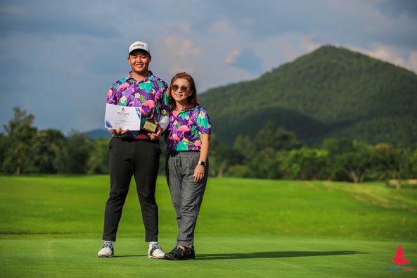 Alpinegolfresort Chiangmai 2 people people golfing golf course and text