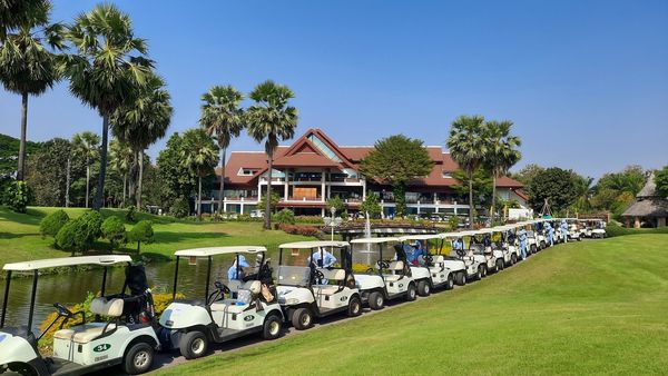 Summit Green Valley Chiangmai Country Club 2 people golf cart and grass Summit Green Valley Chiangmai Country Club 2 people golf cart and grass