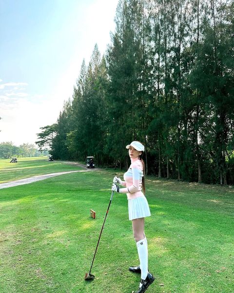 North Hill Golf Club 1 person standing golfing and grass