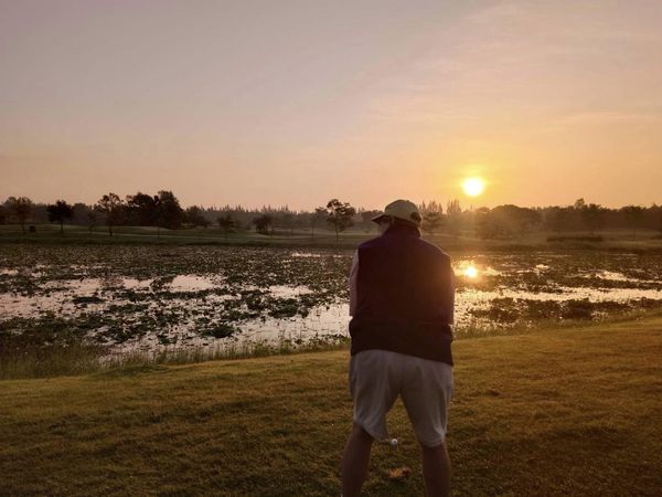 สนามกอล์ฟหริภุญชัย กอล์ฟคลับ 1 person twilight grass golf course and nature