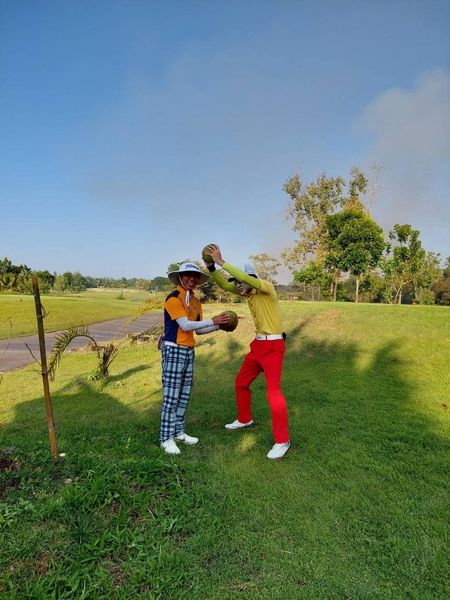 สนามกอล์ฟหริภุญชัย กอล์ฟคลับ 2 people people standing grass golf course and tree