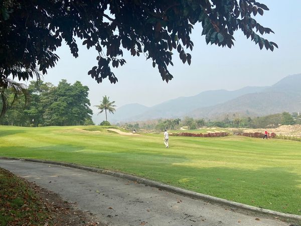 Gassan Khuntan Golf amp Resort Thailand 2 people grass nature and golf course