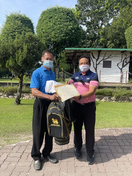 Royal Hua Hin Golf Course 2 people people standing outdoors and Hole One SINGHA Royal Hua Hin Golf Course 2 people people standing outdoors and Hole One SINGHA