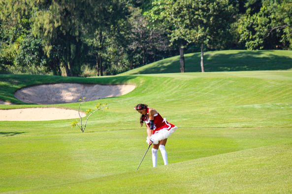 Banyan Golf Club Hua Hin 1 person golfing golf course and grass Banyan Golf Club Hua Hin 1 person golfing golf course and grass