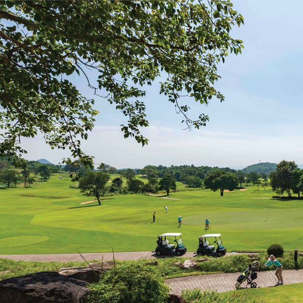Banyan Golf Club Hua Hin 4 people tree golf course nature and grass