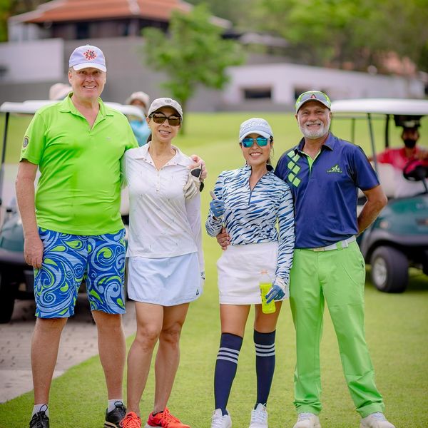 Banyan Golf Club Hua Hin 5 people people golfing golf cart golf course and text