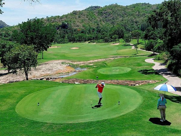 Banyan Golf Club Hua Hin 2 people people golfing golf buggy and golf course