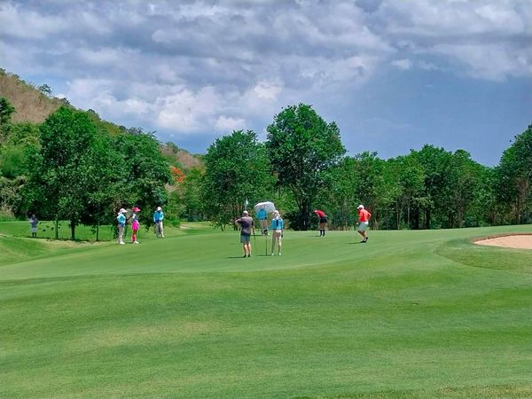 Banyan Golf Club Hua Hin 8 people people golfing golf buggy and golf course