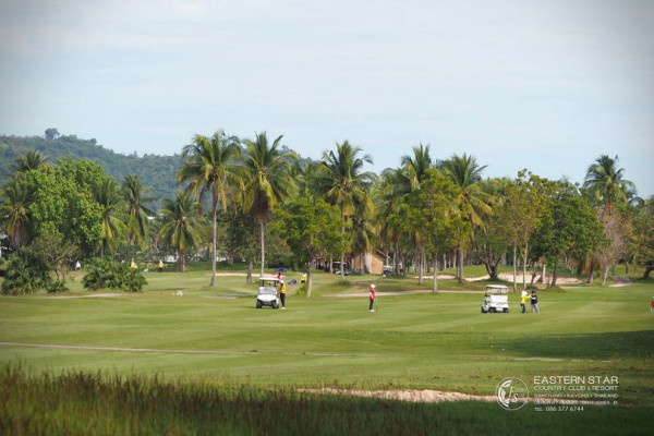 Eastern Star Country Club amp Resort 2 people nature grass palm trees golf course and sky