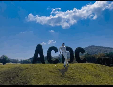 ศูนย์พัฒนากีฬา สอ รฝ ACDC Golf Course 1 person sky tree and text ศูนย์พัฒนากีฬา สอ รฝ ACDC Golf Course 1 person sky tree and text