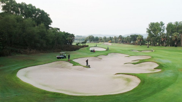 Amata Spring Country Club 2 people people golfing golf cart and golf course