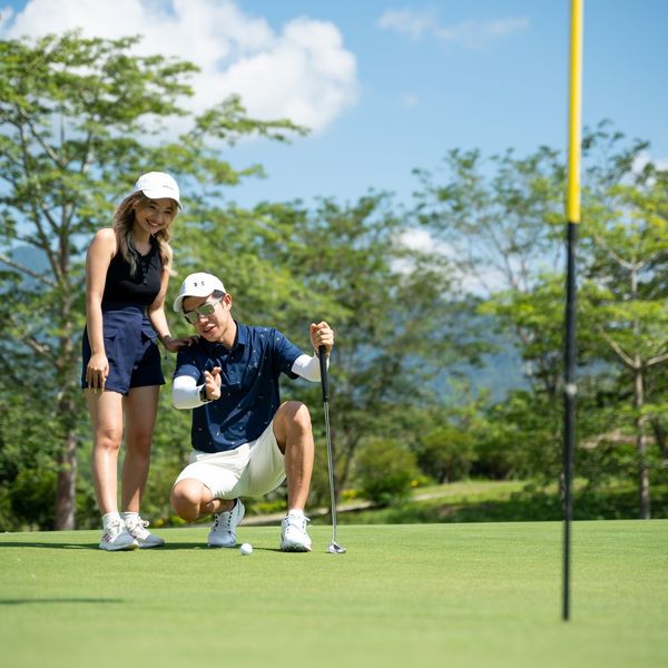Chatrium Golf Resort Soi Dao Chanthaburi 2 people people golfing golf cart and golf course