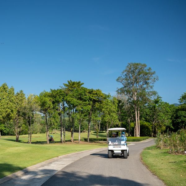 Chatrium Golf Resort Soi Dao Chanthaburi 3 people people golfing golf cart and golf course
