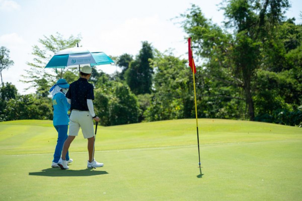 Chatrium Golf Resort Soi Dao Chanthaburi 2 people people golfing golf cart and golf course