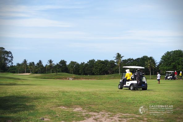 Eastern Star Country Club amp Resort 3 people people golfing golf cart golf course and text