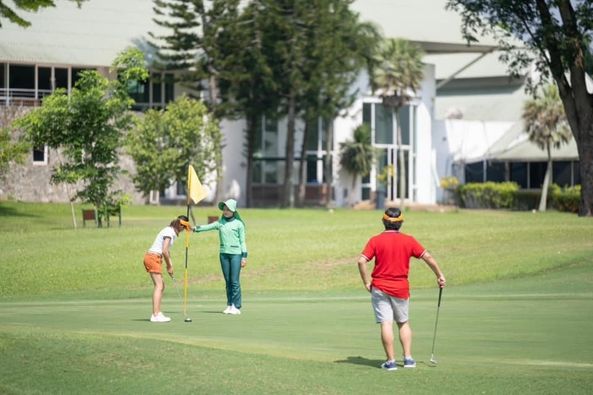 Greenwood Golf Club 3 people people golfing and golf course